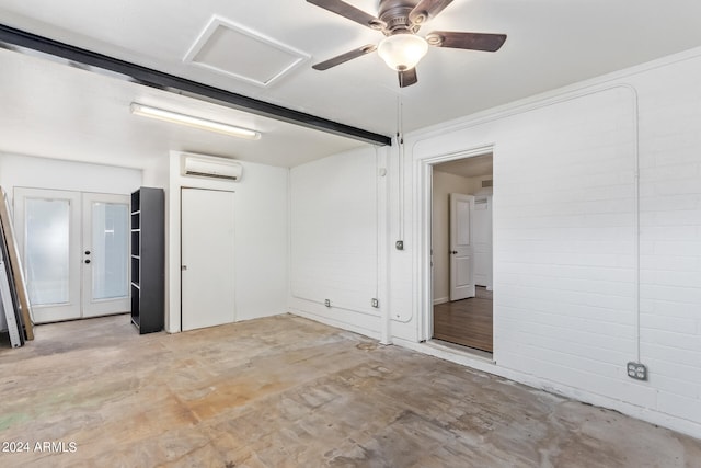 empty room with ceiling fan and a wall mounted AC