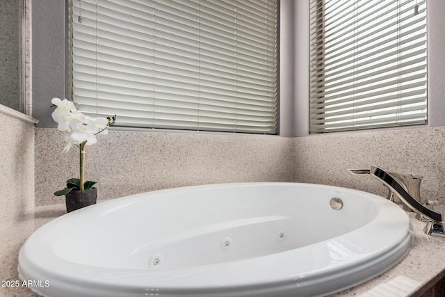 bathroom with a jetted tub