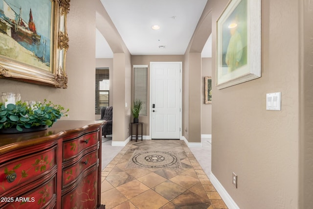 entryway featuring baseboards