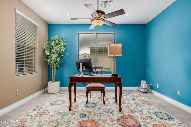 office featuring visible vents, baseboards, carpet floors, and a ceiling fan