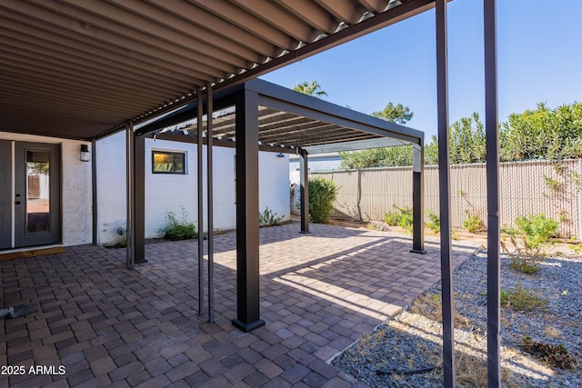 view of patio / terrace featuring fence