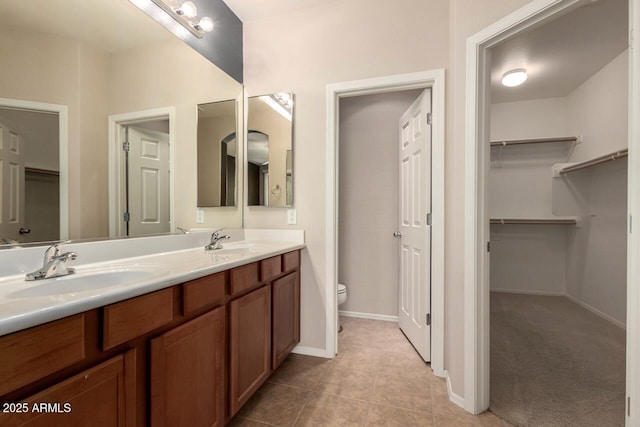 42424 N Gavilan Peak Pkwy Unit 57104, Anthem, AZ 85086 - bathroom featuring double vanity, a walk in closet, and tile patterned flooring