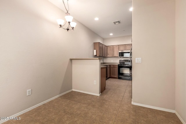 42424 N Gavilan Peak Pkwy Unit 57104, Anthem, AZ 85086 - kitchen with stainless steel microwave, electric range, a chandelier, light tile patterned flooring, and recessed lighting