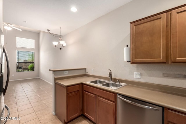 42424 N Gavilan Peak Pkwy Unit 57104, Anthem, AZ 85086 - kitchen with stainless steel appliances, light tile patterned floors, a peninsula, brown cabinets, and recessed lighting