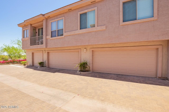 42424 N Gavilan Peak Pkwy Unit 57104, Anthem, AZ 85086 - view of property with decorative driveway, stucco siding, and a garage