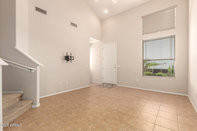 42424 N Gavilan Peak Pkwy Unit 57104, Anthem, AZ 85086 - unfurnished room featuring a high ceiling, light tile patterned flooring, a ceiling fan, and stairs