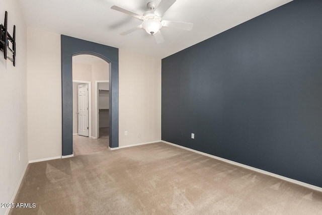 42424 N Gavilan Peak Pkwy Unit 57104, Anthem, AZ 85086 - carpeted empty room with arched walkways and ceiling fan