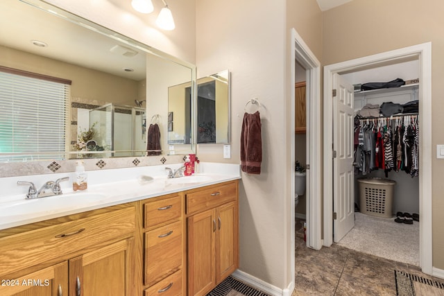 bathroom featuring vanity, tile patterned floors, and an enclosed shower