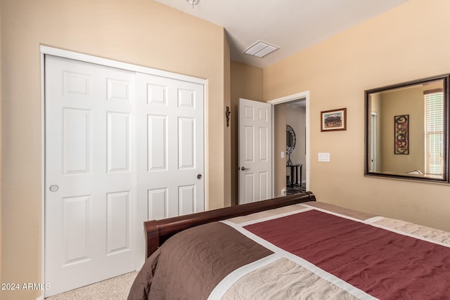 bedroom with a closet and carpet