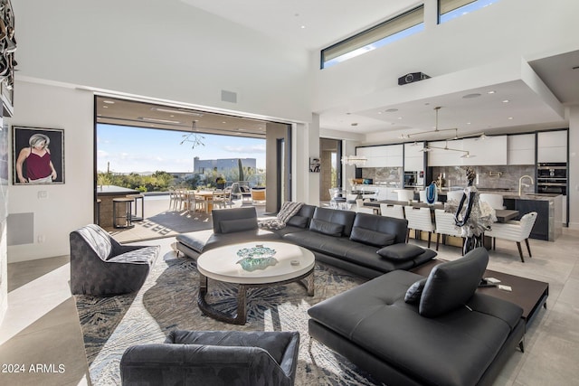 tiled living room featuring a high ceiling