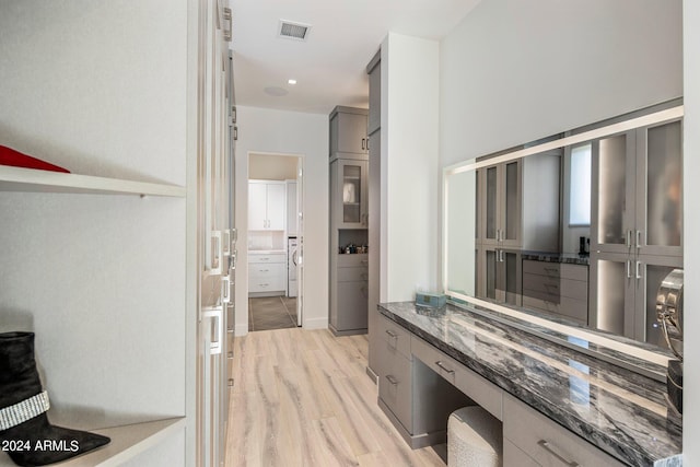 interior space featuring vanity and hardwood / wood-style flooring