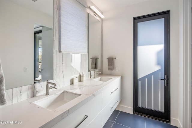 bathroom featuring tile flooring and double sink vanity