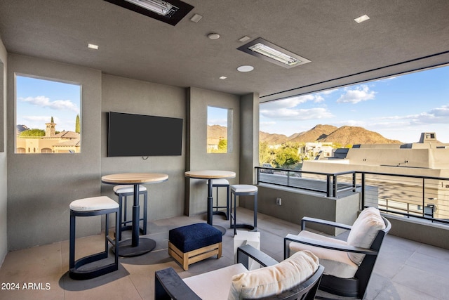 interior space with a mountain view and outdoor lounge area