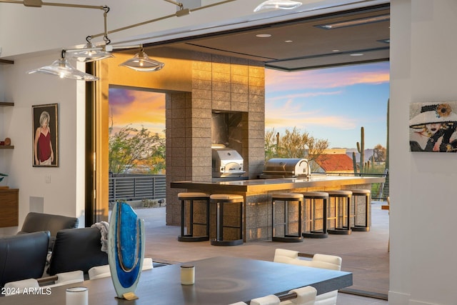 dining space with tile walls