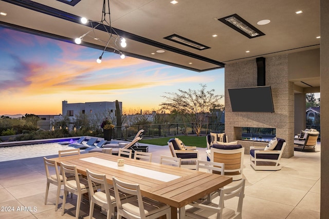 view of patio terrace at dusk