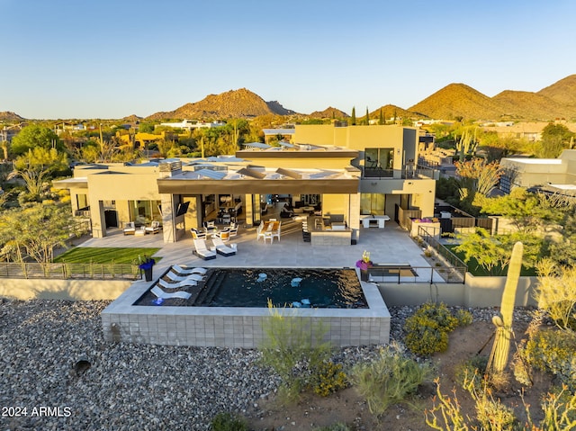 exterior space featuring a patio area and a mountain view