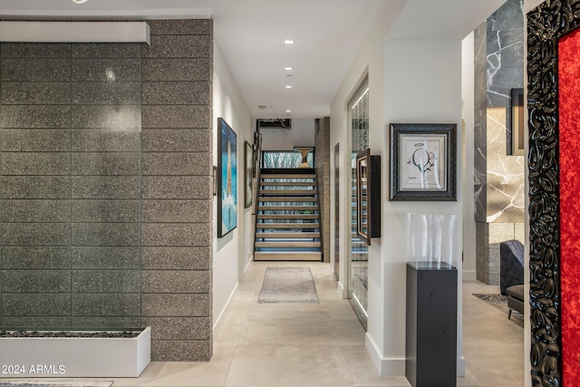 hall with light tile flooring