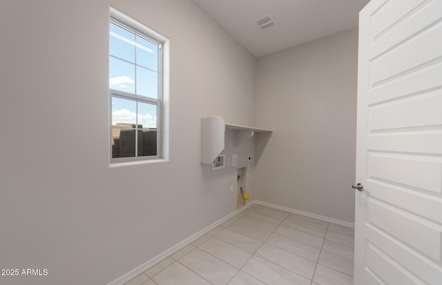 laundry room featuring light tile patterned floors, hookup for a gas dryer, hookup for an electric dryer, laundry area, and baseboards