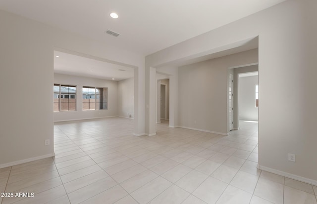 unfurnished room featuring recessed lighting, visible vents, baseboards, and light tile patterned floors