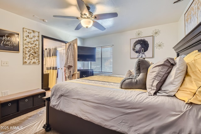 bedroom featuring ceiling fan and a closet