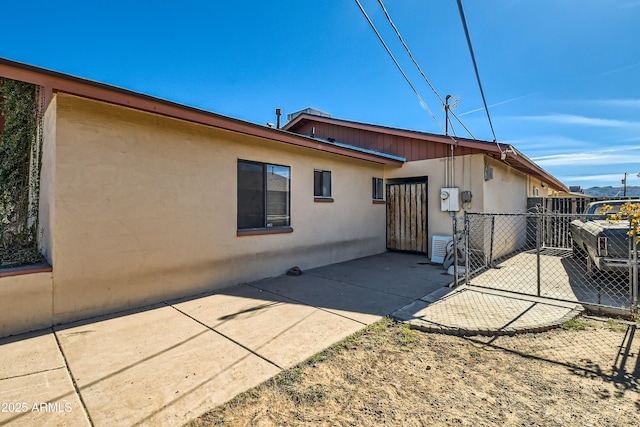 back of property with a patio