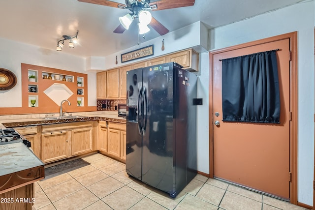 kitchen featuring light brown cabinetry, sink, black fridge with ice dispenser, and light tile patterned floors