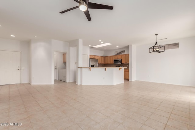 unfurnished living room featuring recessed lighting and a ceiling fan