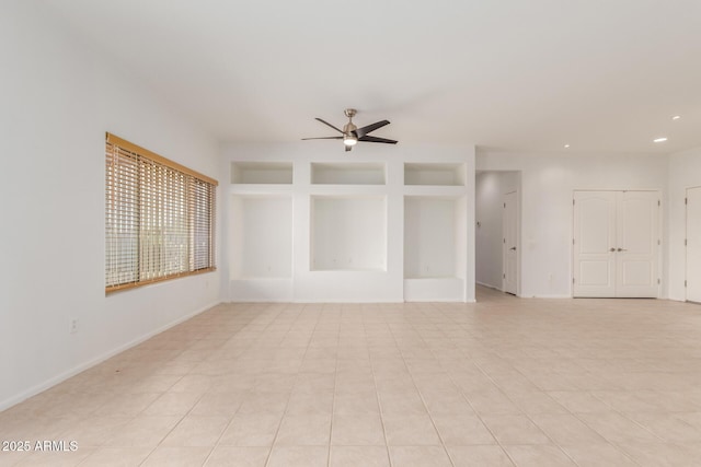 spare room with recessed lighting, a ceiling fan, and baseboards