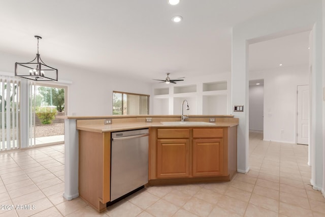 kitchen with a sink, light countertops, dishwasher, decorative light fixtures, and ceiling fan with notable chandelier