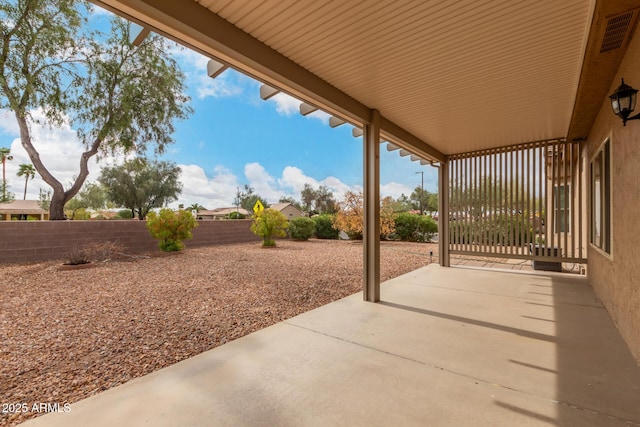 view of patio featuring a fenced backyard and visible vents