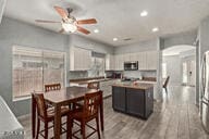 dining area featuring ceiling fan and light hardwood / wood-style flooring