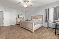 bedroom with ceiling fan and carpet flooring