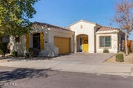 mediterranean / spanish house featuring a garage