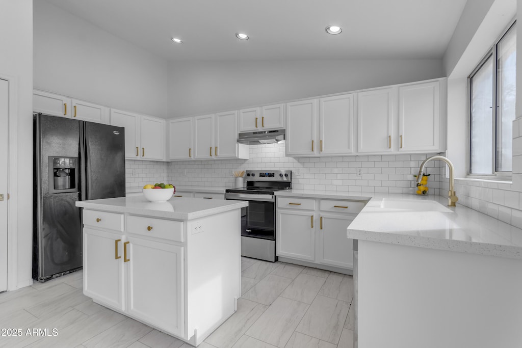 kitchen with black fridge with ice dispenser, white cabinetry, high vaulted ceiling, a kitchen island, and stainless steel range with electric cooktop