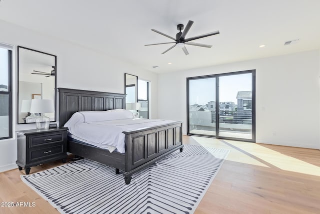 bedroom with access to exterior, ceiling fan, and light hardwood / wood-style floors