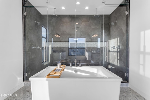 bathroom with tile patterned floors, independent shower and bath, and tile walls