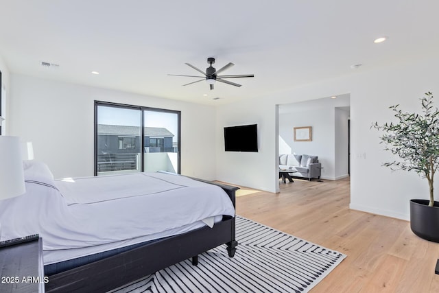 bedroom featuring light hardwood / wood-style floors and ceiling fan