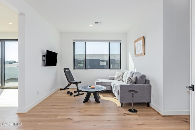 sitting room with light hardwood / wood-style floors