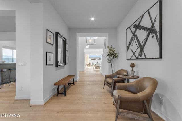 corridor with light hardwood / wood-style flooring