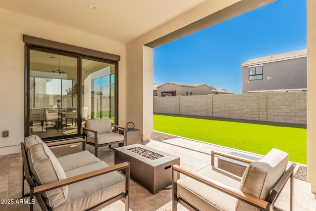 view of patio featuring an outdoor living space with a fire pit