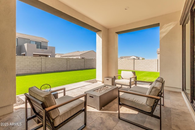 view of patio with an outdoor living space with a fire pit