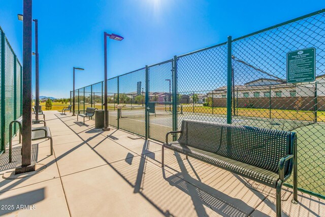 exterior space with tennis court