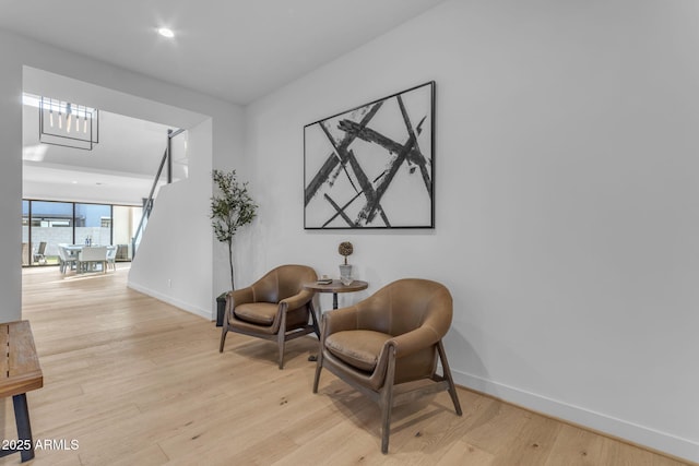 sitting room with light hardwood / wood-style flooring