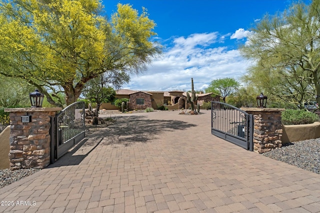 view of gate with fence