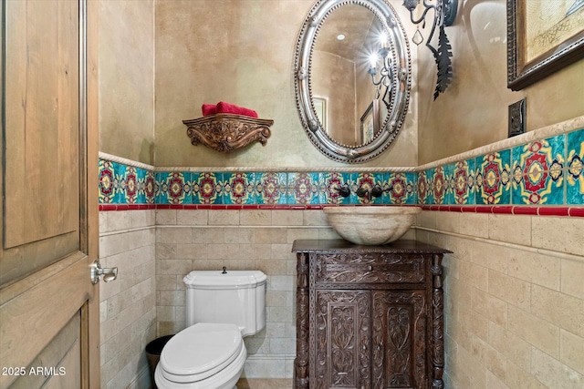 half bathroom featuring toilet and vanity