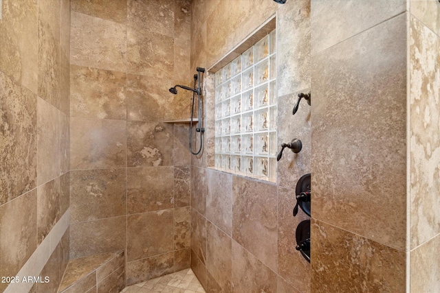 full bath with tiled shower