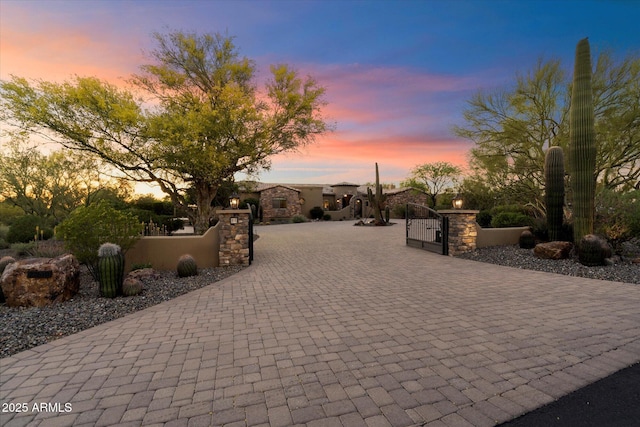 view of property's community with a fenced front yard and a gate