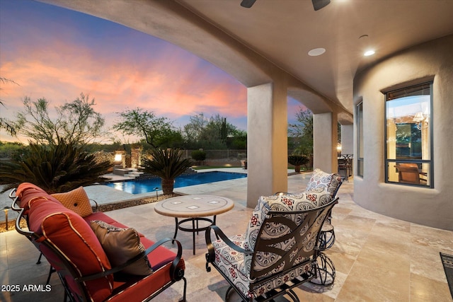view of patio with a fenced in pool