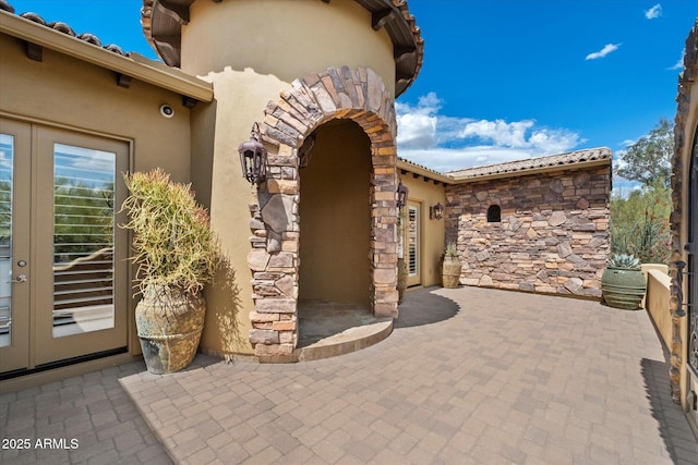view of patio featuring french doors