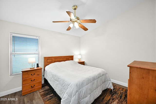 bedroom with dark wood finished floors, baseboards, and ceiling fan